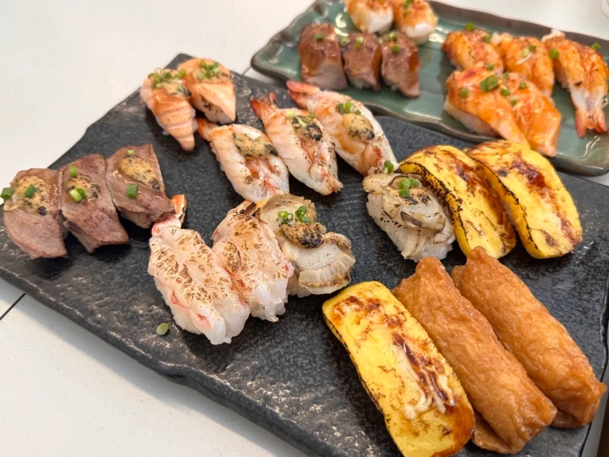 Flame-seared sushi with soy sauce and wasabi