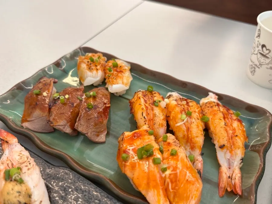 A savory, lightly cooked piece of flame-seared sushi