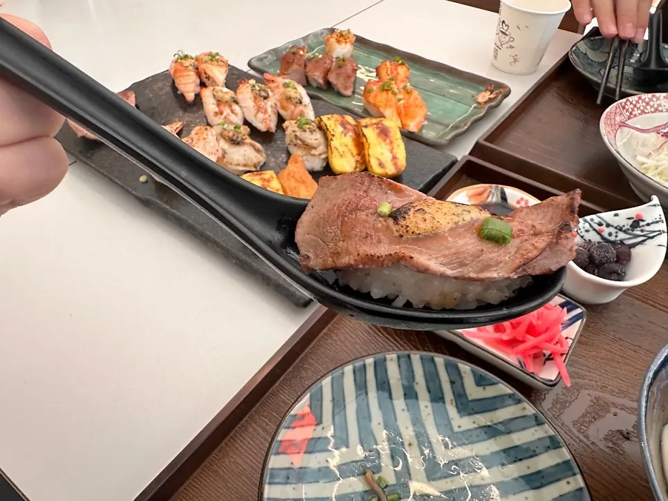Flame-seared salmon and shrimp sushi