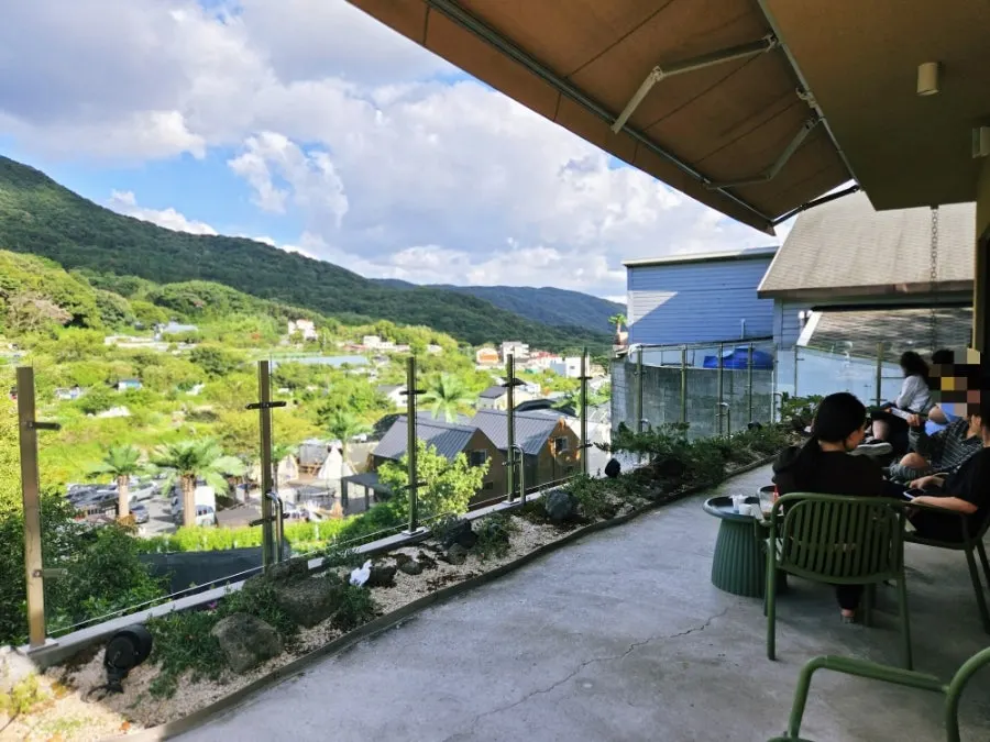 Outdoor terrace seating decorated with bonsai trees