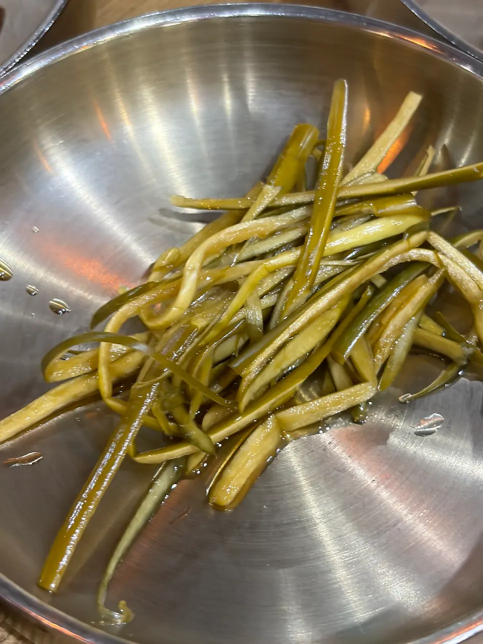 A plate with kimchi and lettuce