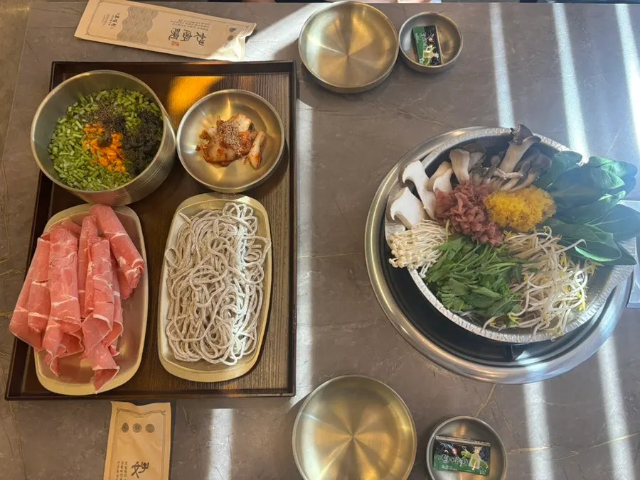 Full table spread of the Hansang-gadeuk Special Agaricus Shabu Kalguksu for two