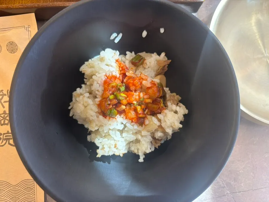 Self-serve station with beef mushroom radish rice, geotjeori and green onion kimchi