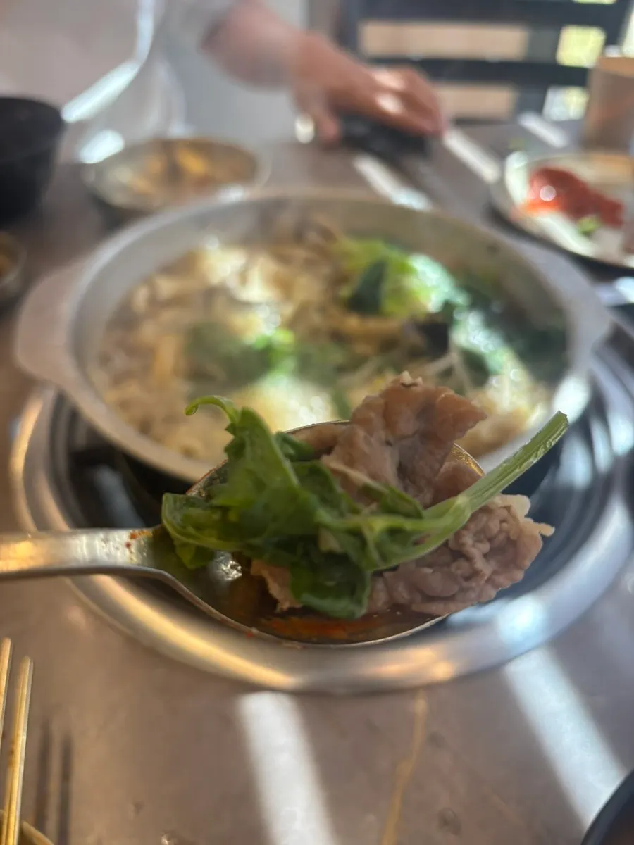 Stir-fried jjukkumi served together with beef mushroom radish rice