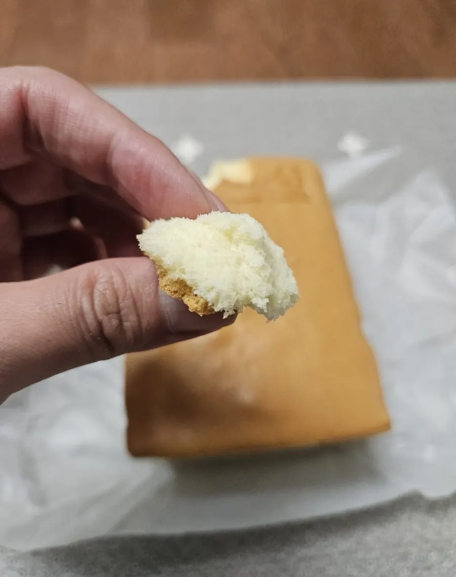A slice of Jinsim Castella showing its soft texture