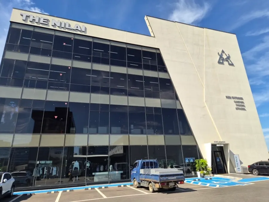 Exterior of The Nillai with its wide parking lot
