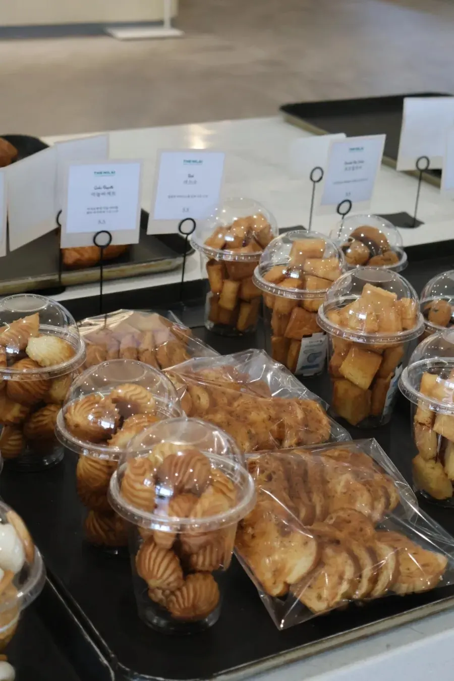Bakery display with garlic baguette and sangtu pastry