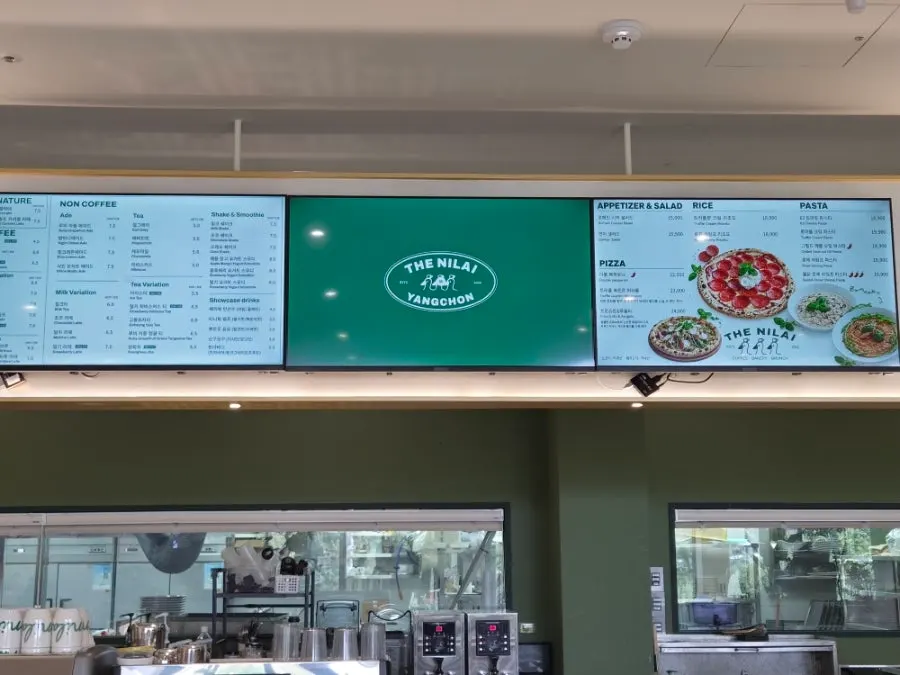 The Nillai's menu board featuring pizza and pasta