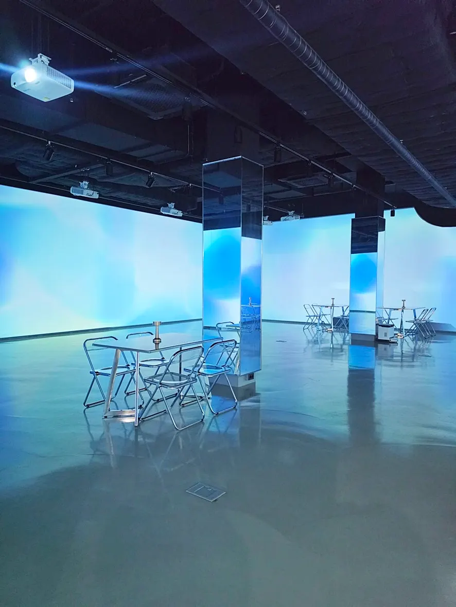 Tables and chairs placed in the media art zone
