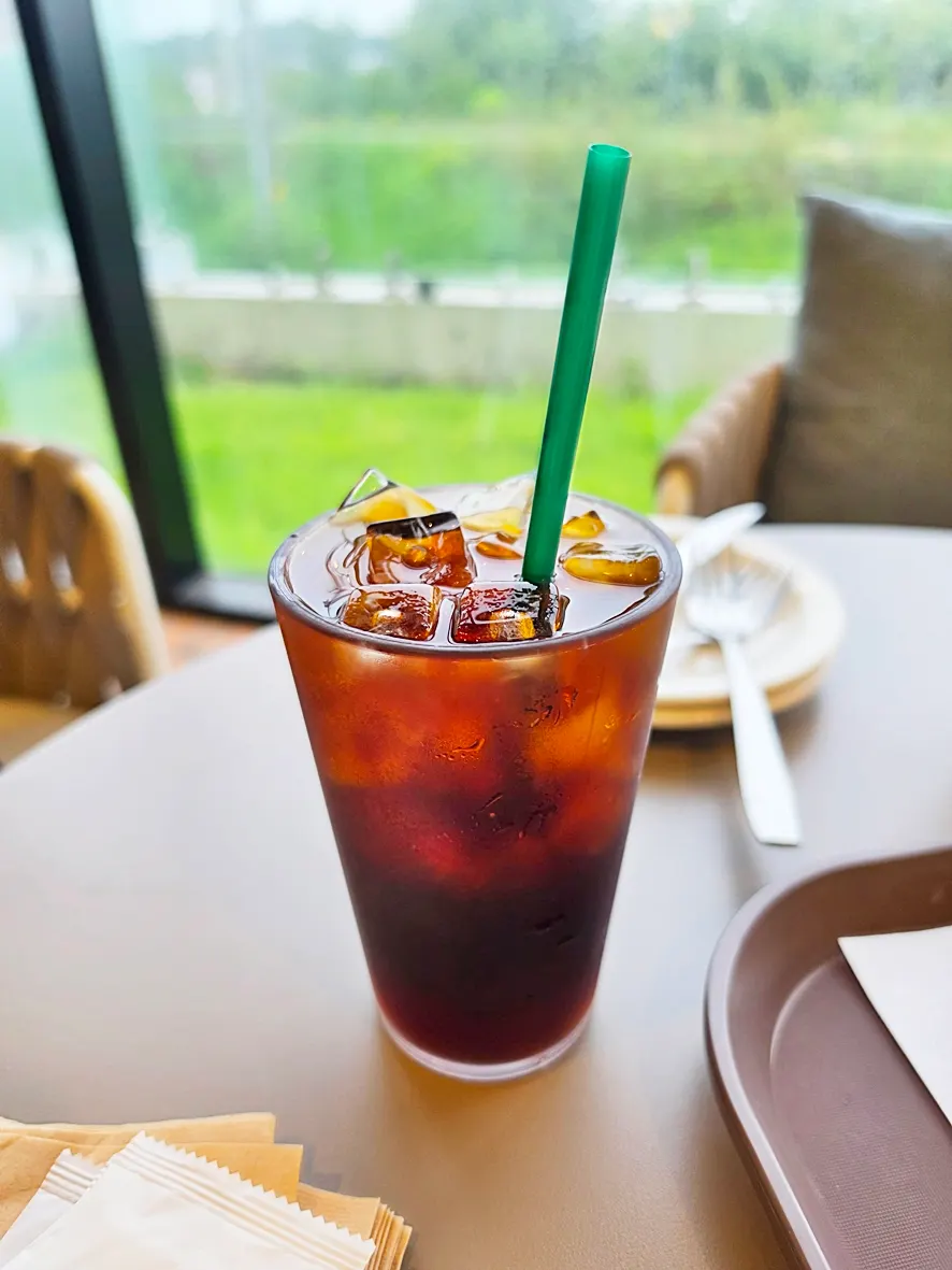 Iced coffee served alongside the bakery items