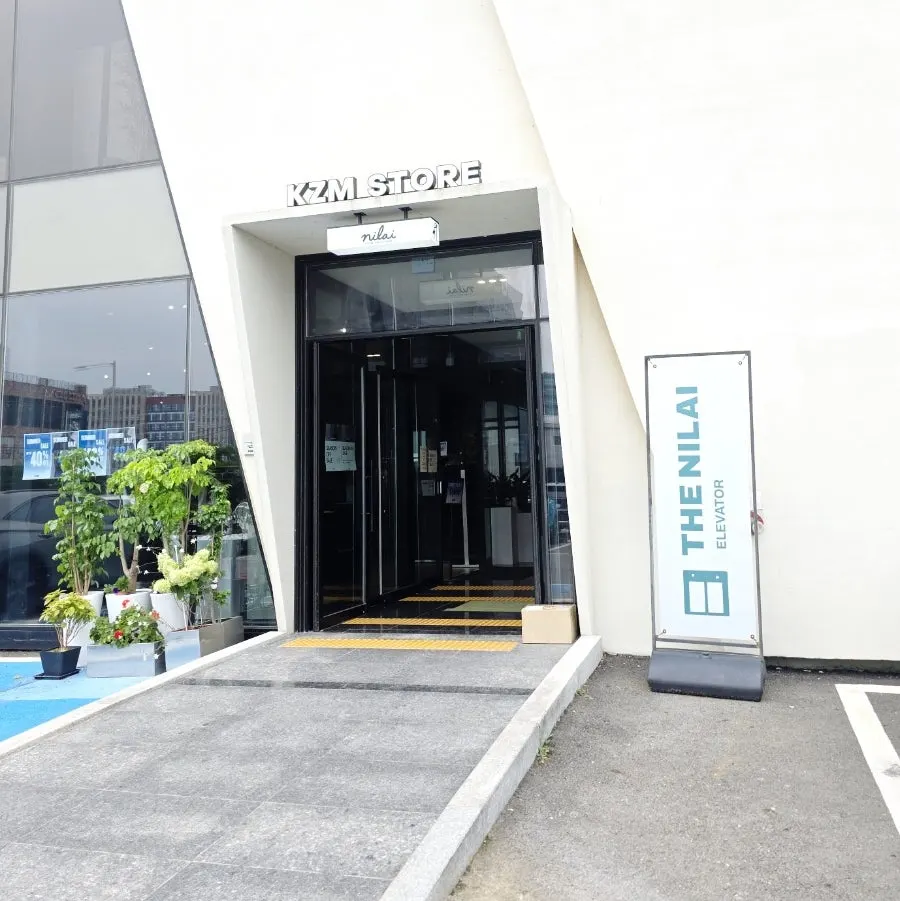 Vertical shot of the exterior in front of The Nillai's building