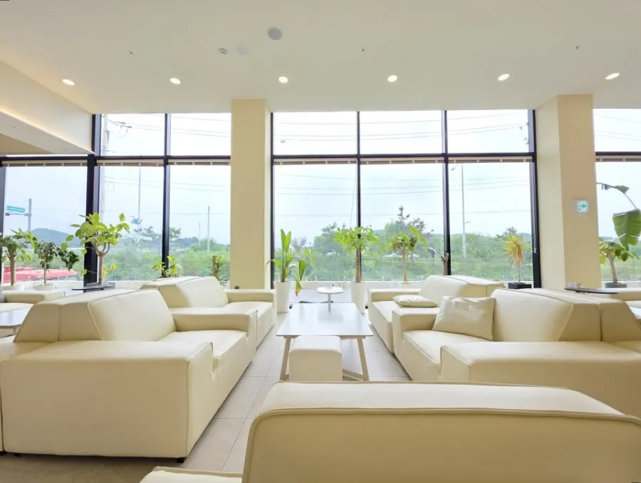 Media room screen visible alongside the seating area