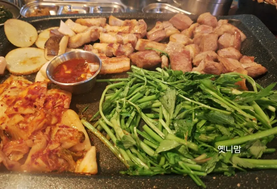 Gim Sukseong pork belly served with minari