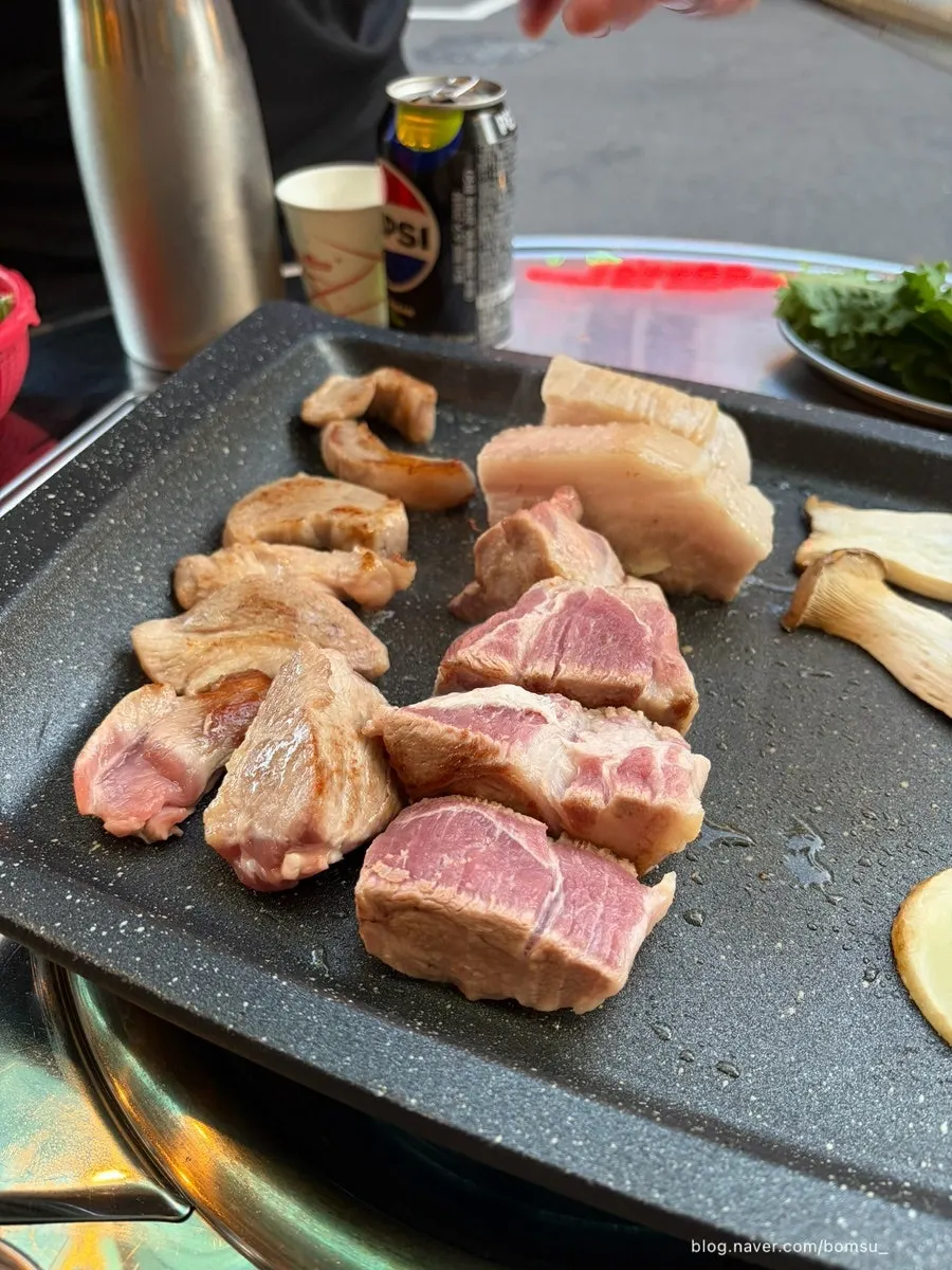 Thick premium pork neck being grilled