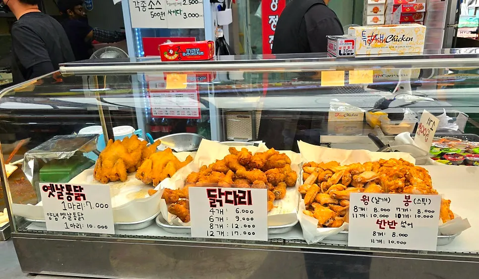 Mr. Kim's Chicken sign with a price banner hanging