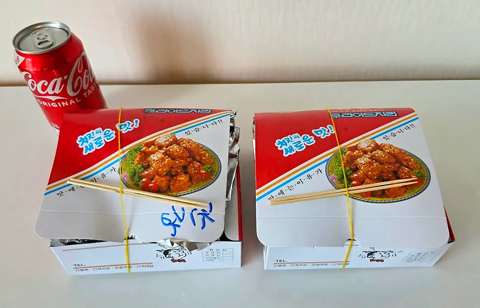 Two boxes of mild and soy-sauce dakgangjeong opened at home