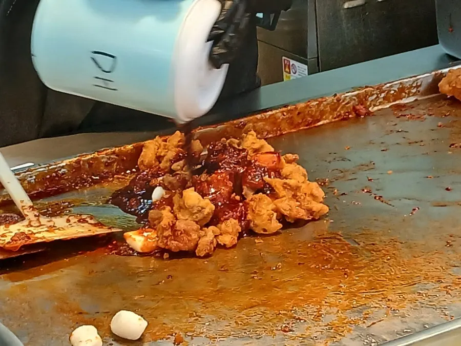 Chicken dipped in the separately sold sauce
