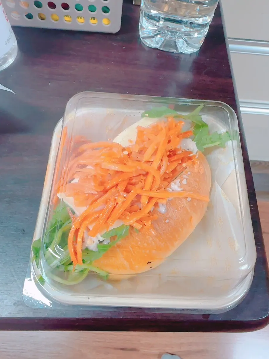 Vertical shot of the carrot râpée chicken sandwich
