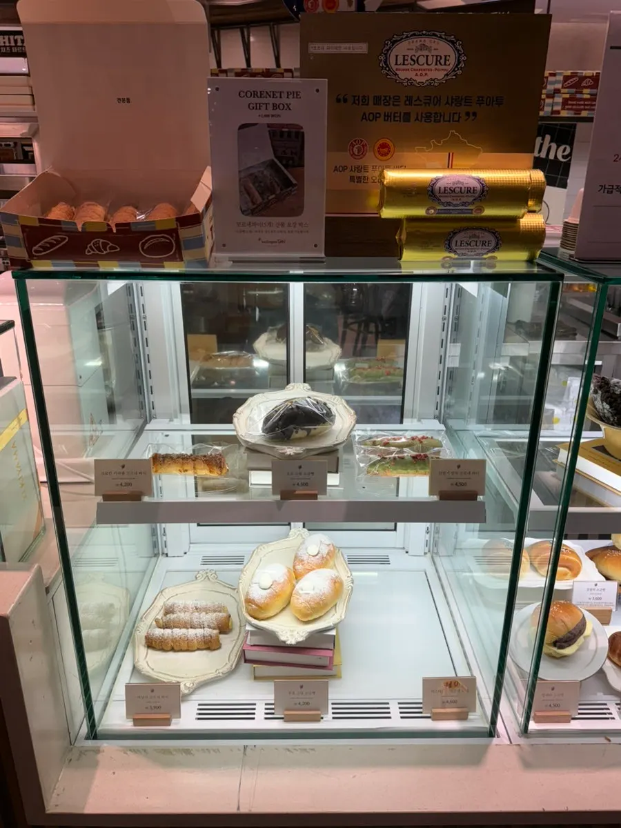 Variety of breads inside the Boulangerie Tan display case