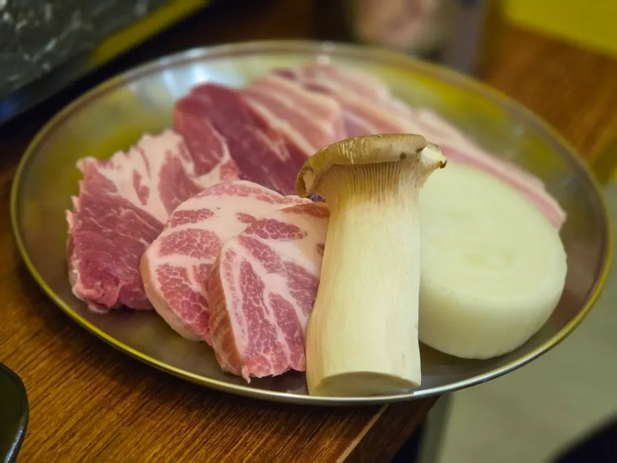 Plate of raw fresh pork belly and pork neck