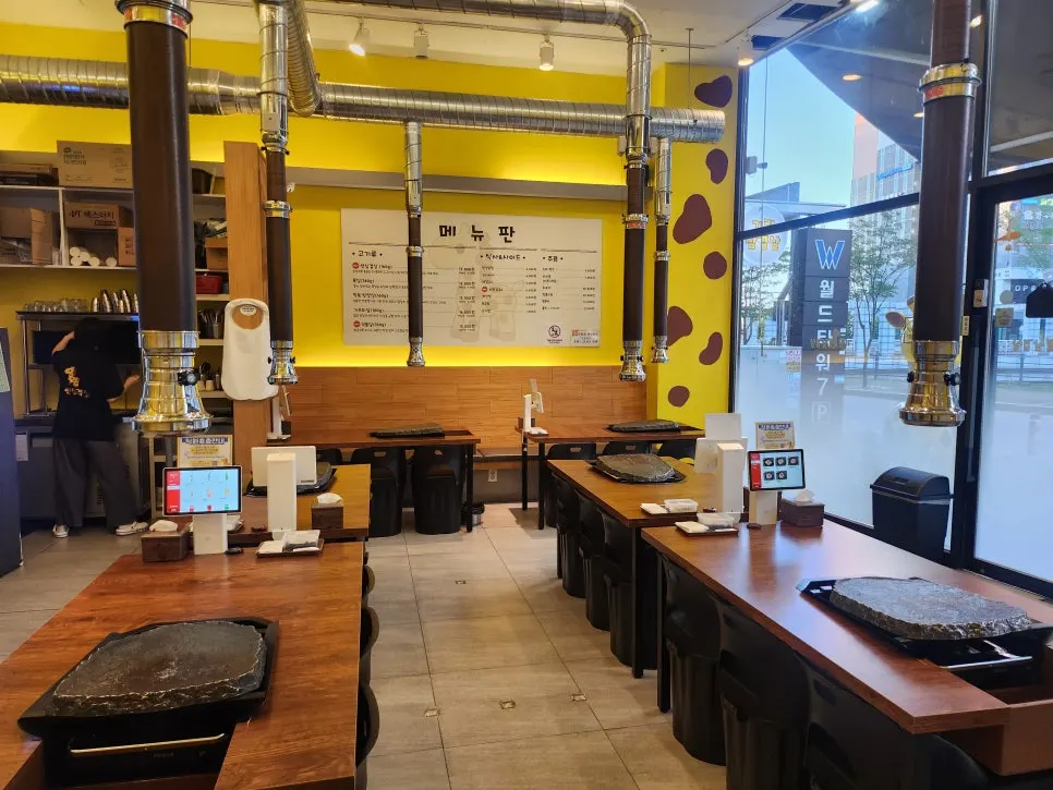 BBQ restaurant table with cast-iron grill set up