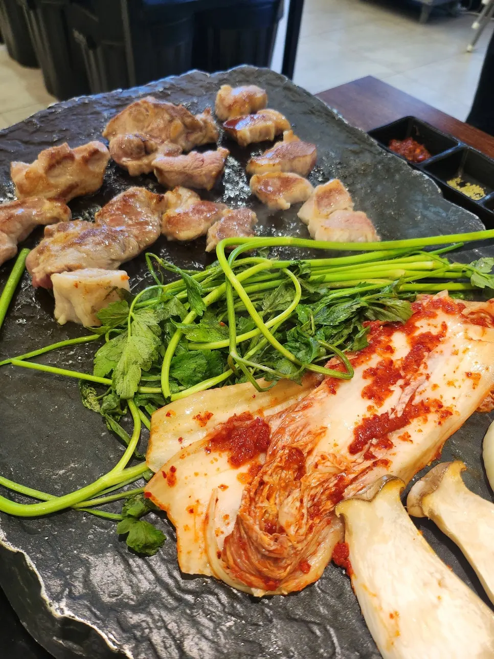 Pork grilled crispy outside and juicy inside on the cast-iron grill