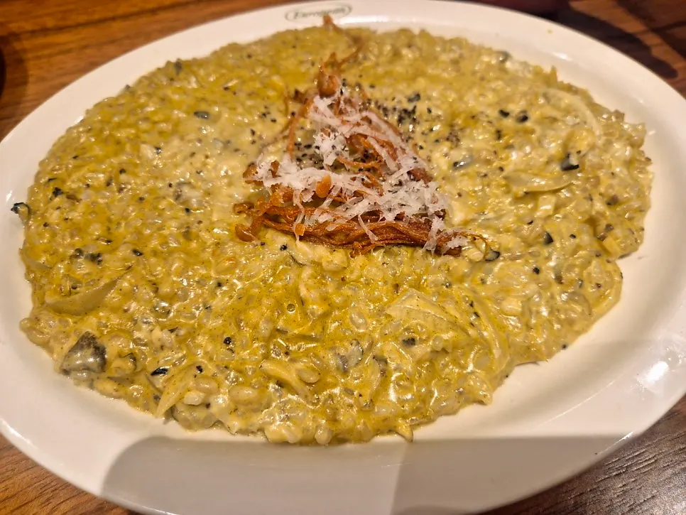 Basil pesto cream pasta with sauce coating the noodles