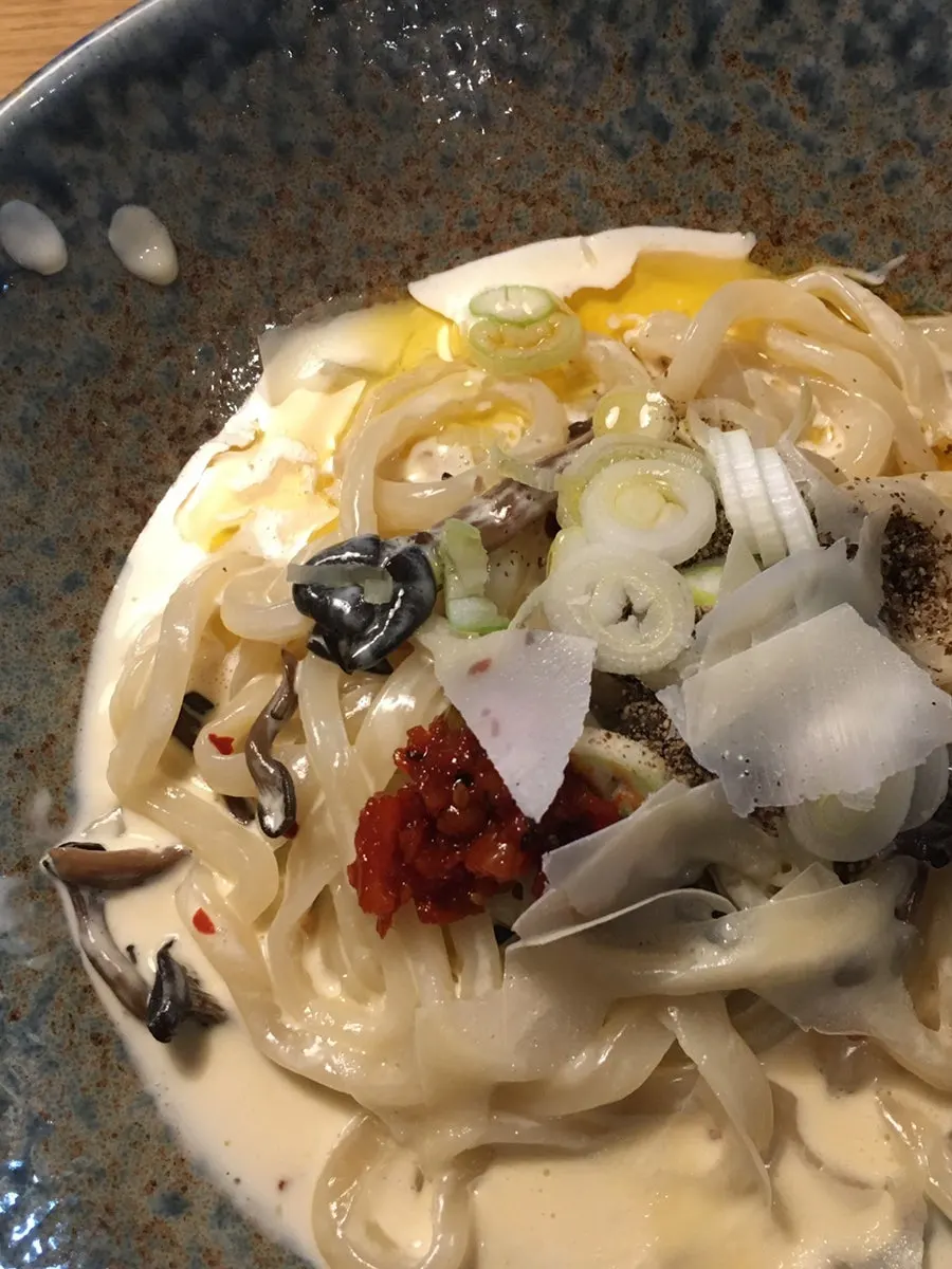 Perilla cream udon topped with mushroom and green onion