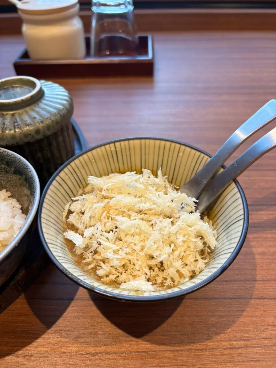 A piece of tonkatsu with salt and wasabi