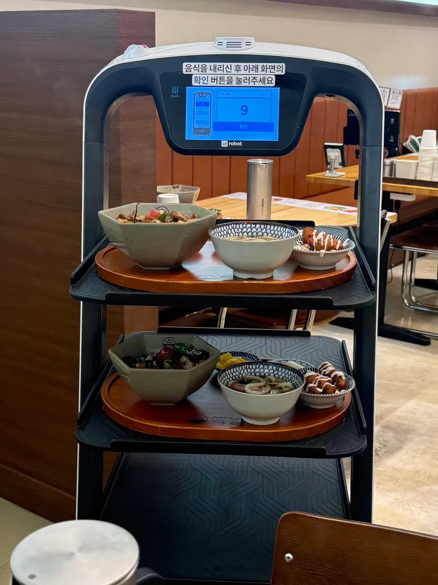 A serving robot delivering food