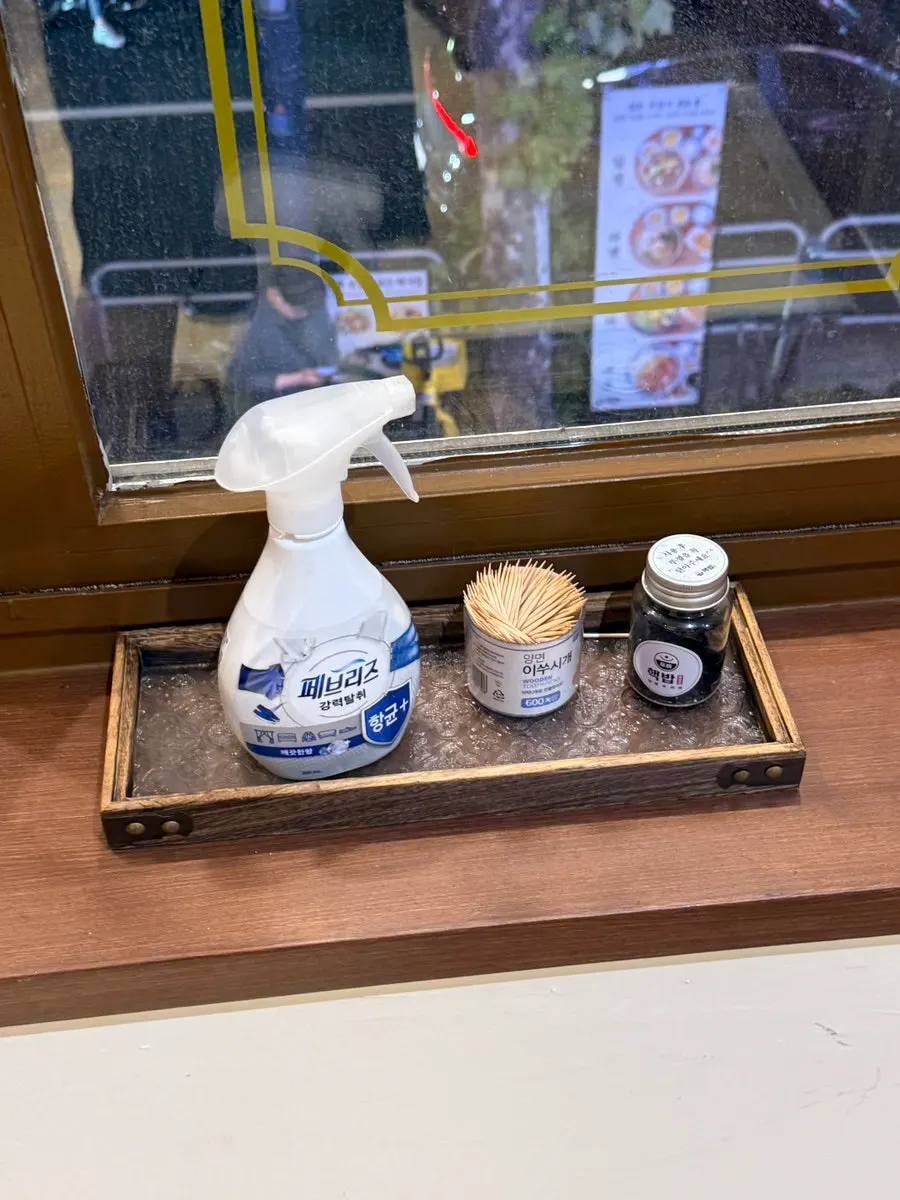 Febreze, toothpicks, and hair ties at the restaurant entrance