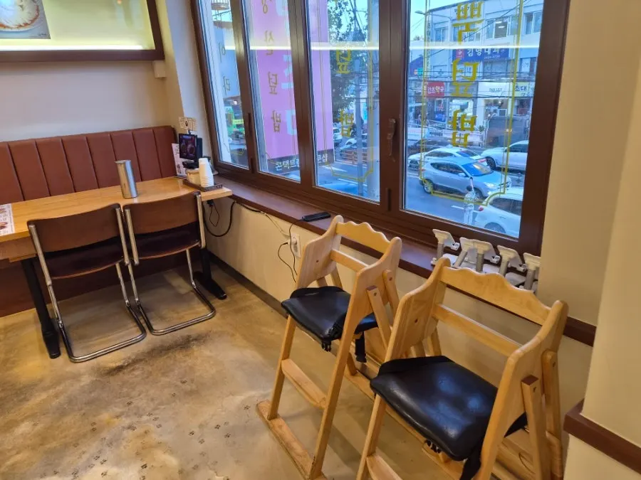 Spacious dining hall tables with high chairs for kids