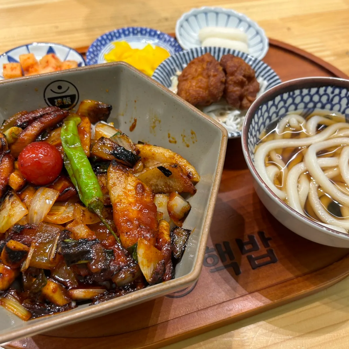 Pork jowl rice bowl set served with mini udon and fried chicken