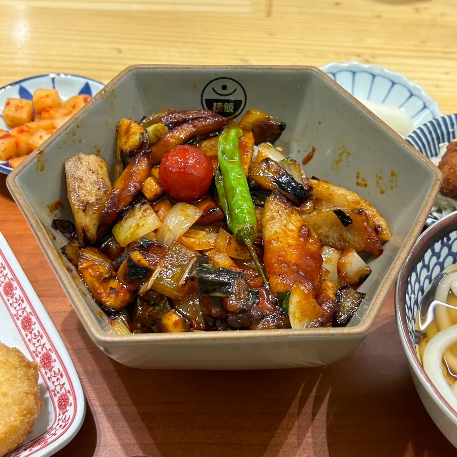 Pork jowl rice bowl topped with spicy special sauce