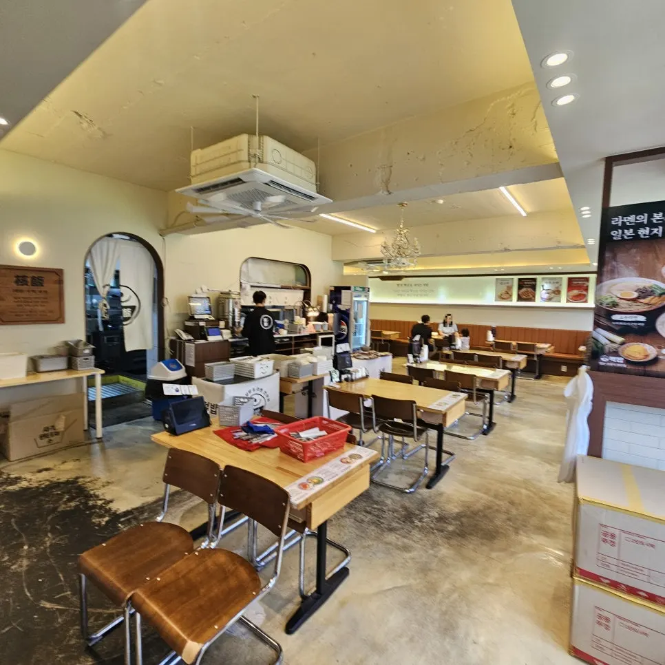 Dining room with four-person tables and window seats