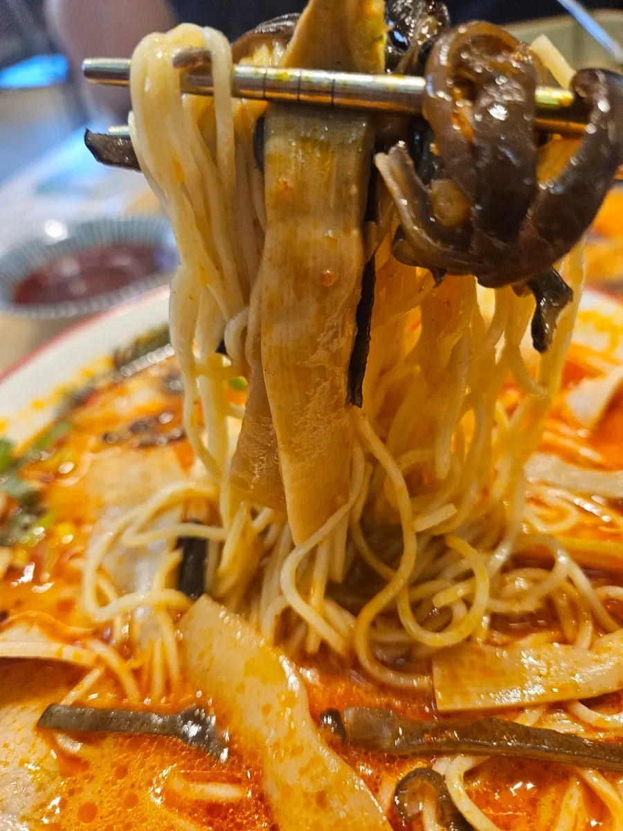 Wood ear mushrooms mixed into the spicy ramen