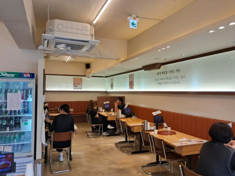 View of seating with customers during a weekday lunch
