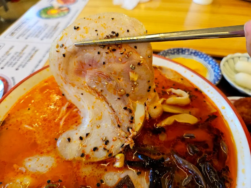 Ramen topped with a large piece of chashu pork