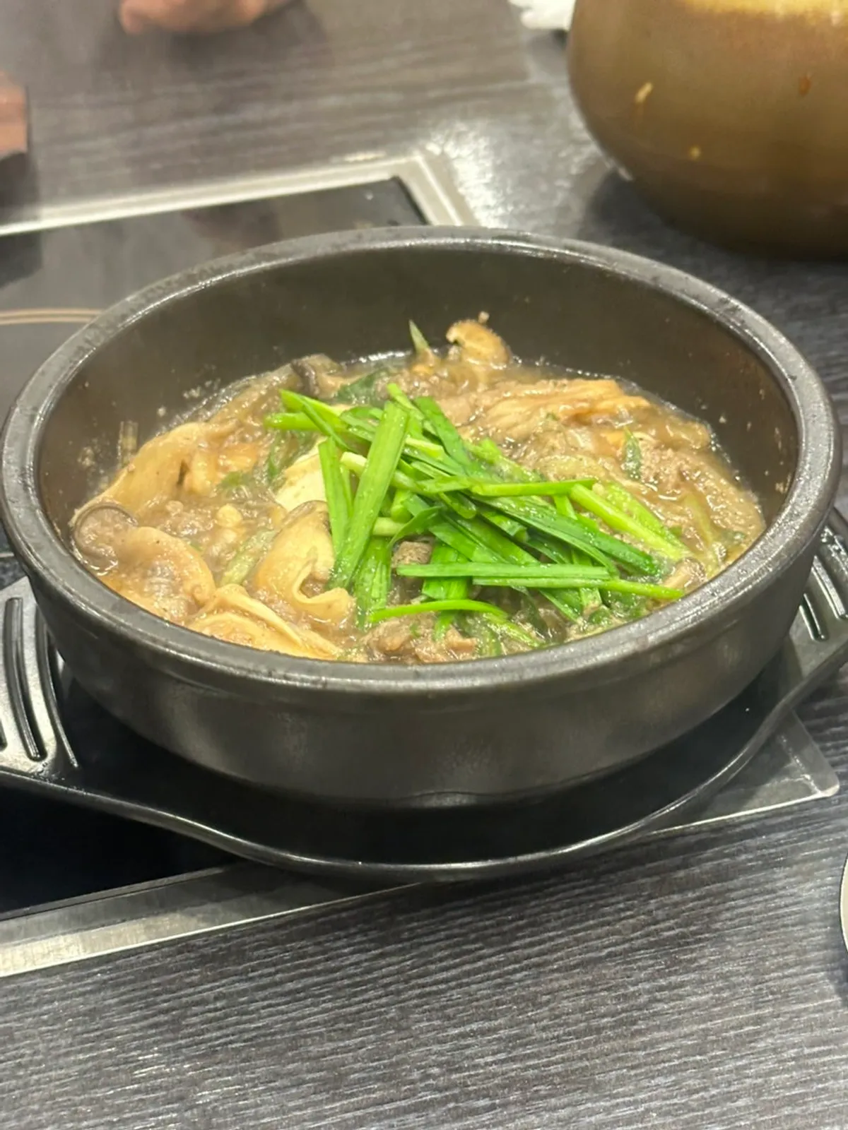 Rich broth served with kimchi