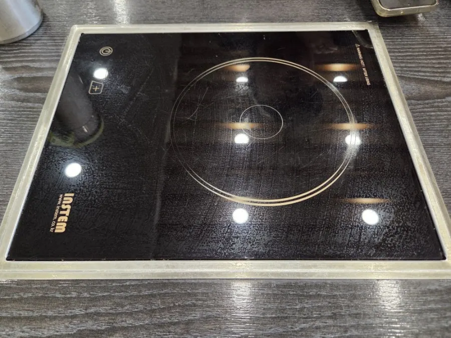Restaurant table with an induction burner