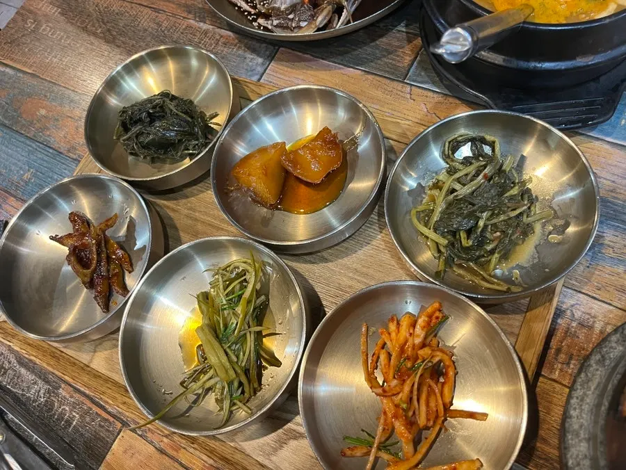 Hanjeongsik table set with brassware banchan and cheonggukjang