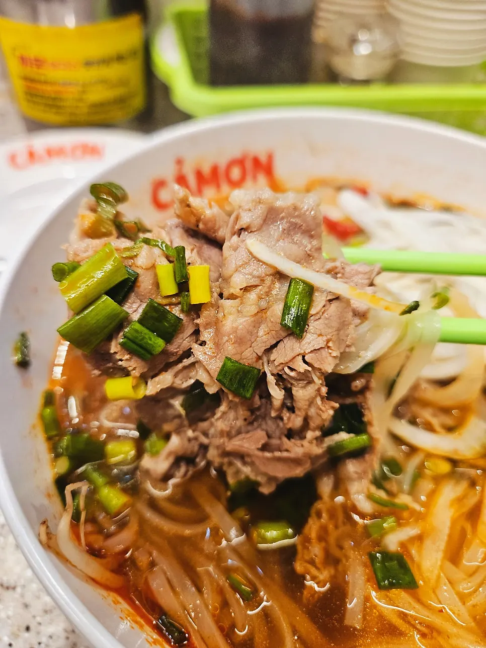 Fiery spicy sauce stirred into the pho broth