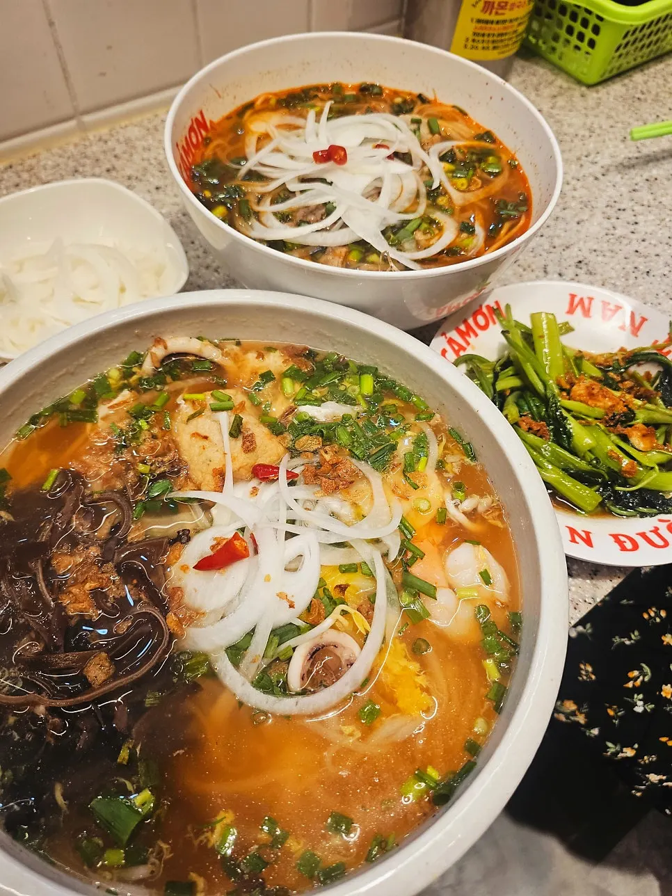 Noodles lifted up from the squid pho