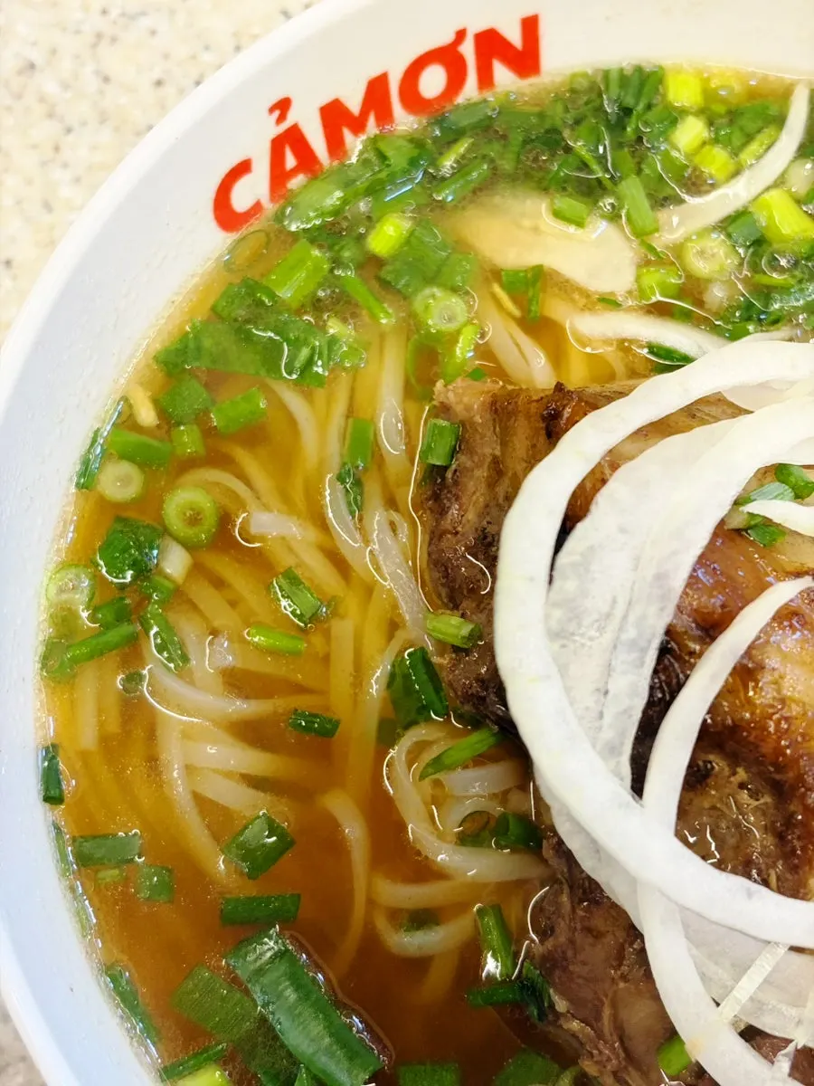 Finishing the bowl of pork backbone pho