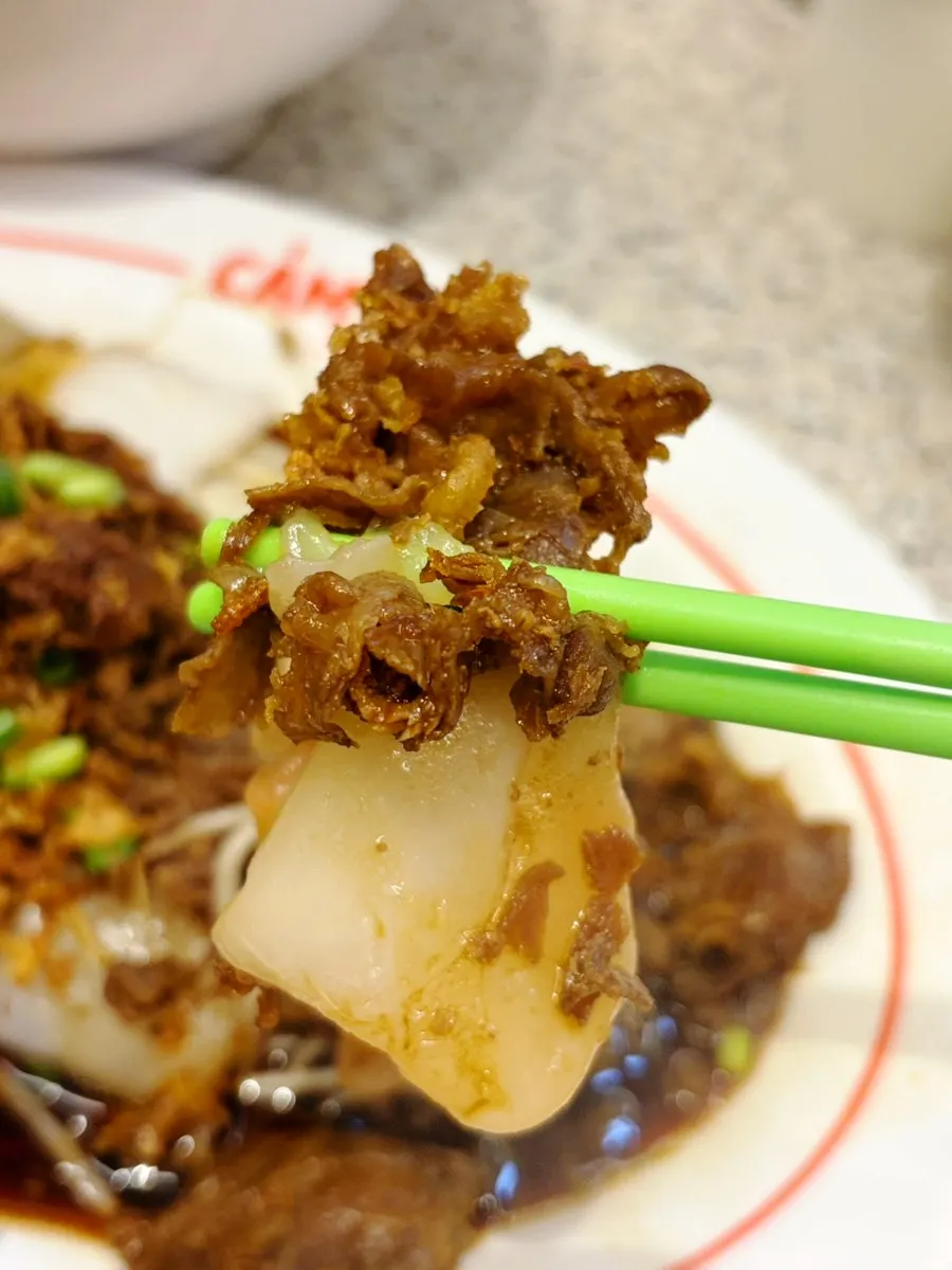 Picking up a piece of bánh cuốn