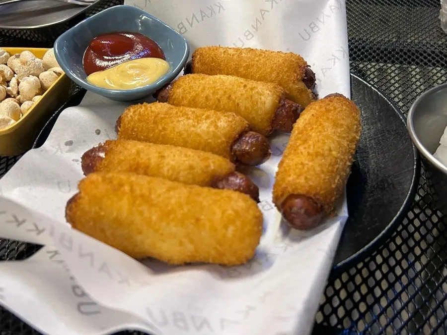 Cross-section of the crispy, chewy crunchy rice hot dog