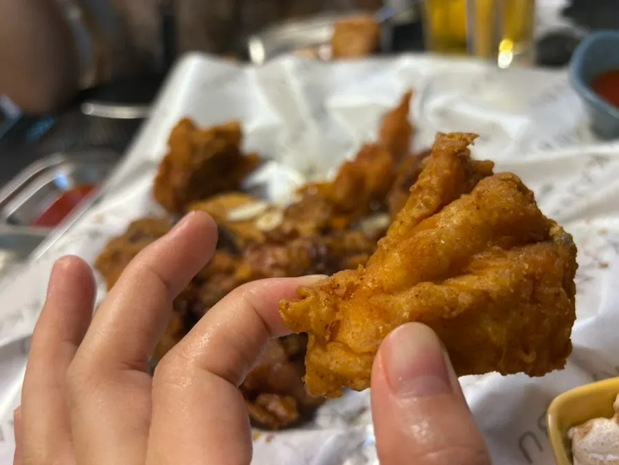 The nearly finished chicken and beer glass