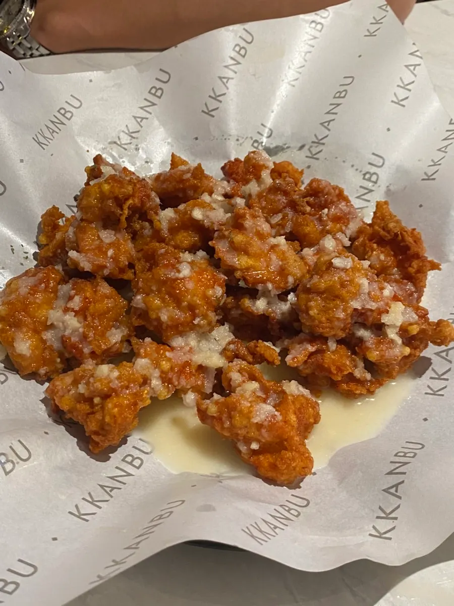 A freshly served plate of spicy garlic hand-made boneless chicken