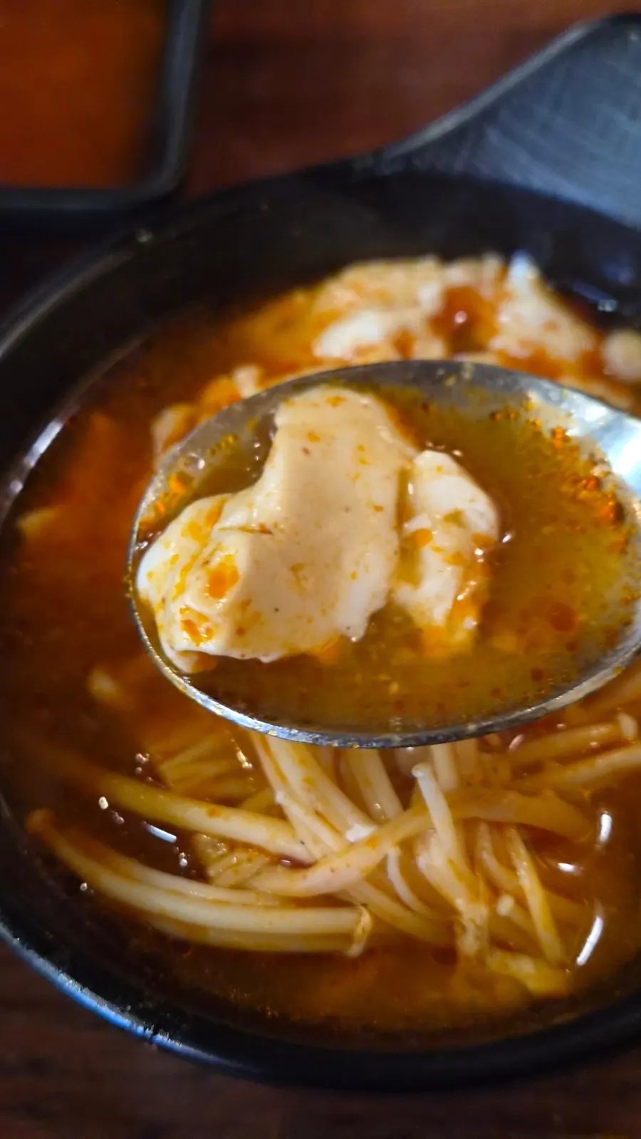 Sundubu jjigae with enoki mushrooms and egg