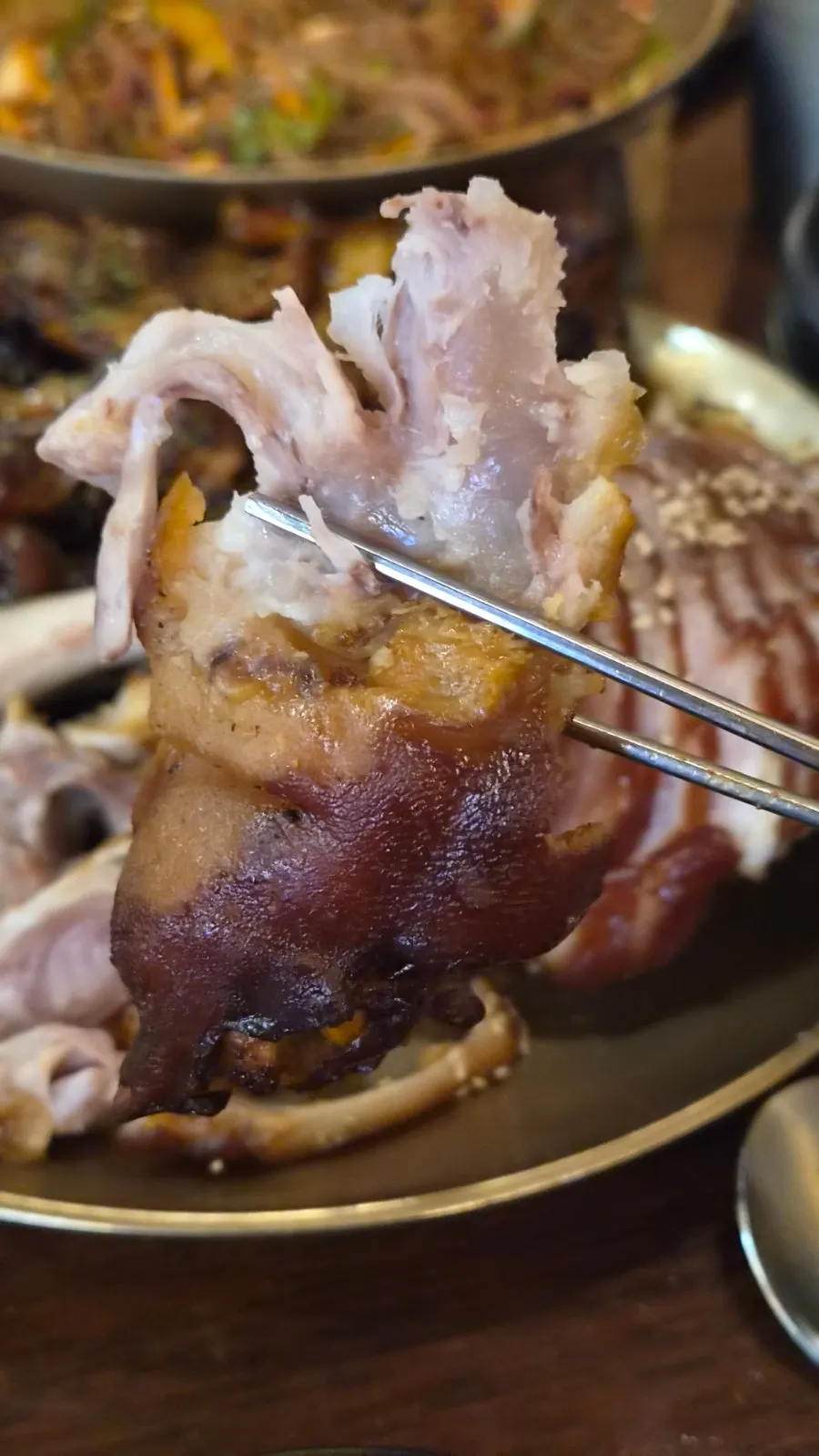 Pulling meat off the bone from the jjokbal